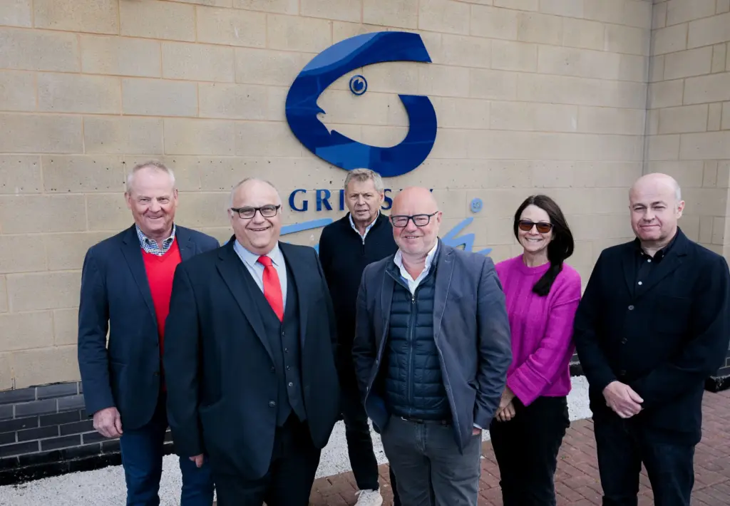 Shareholders and chair of Grimsby Fish Dock Enterprises Ltd, outside the main entrance to the business.
