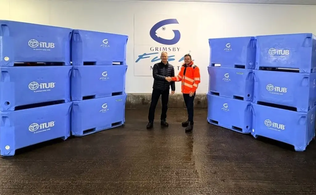 The two men involved in a deal for 660l containers - also in view - at Grimsby Fish Market.